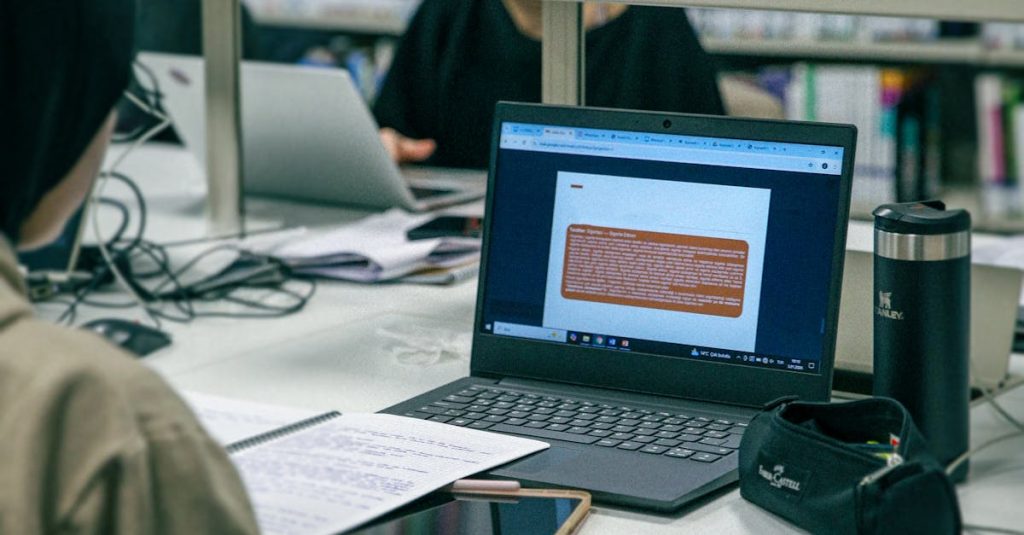 How Indian Students Evaluate and Shortlist the Best Country for Higher Studies 4 Students studying with laptops and books in a modern library environment, focused and engaged.
